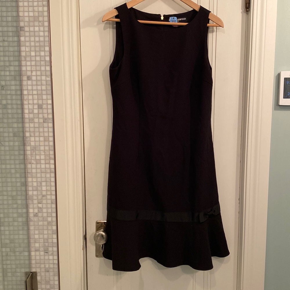 Karl Lagerfeld little black dress. Size 8. Fun flirty hem with a bow.
